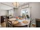 Cozy dining area with a large wooden table and access to an outdoor patio at 3356 Longleaf Estates Dr, Raleigh, NC 27616