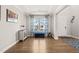 Bright foyer with hardwood floors, blue accents and natural light from large windows at 3356 Longleaf Estates Dr, Raleigh, NC 27616