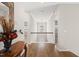 Bright hallway with hardwood floors and elegant trim at 3356 Longleaf Estates Dr, Raleigh, NC 27616