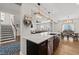 Open kitchen with large island featuring pendant lighting, open to the dining and Gathering rooms at 3356 Longleaf Estates Dr, Raleigh, NC 27616