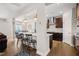 Open kitchen features a large island with seating, stainless steel appliances and access to dining area at 3356 Longleaf Estates Dr, Raleigh, NC 27616