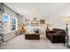 Bright living room with blue and white patterned curtains, hardwood floors and elegant accent furniture at 3356 Longleaf Estates Dr, Raleigh, NC 27616