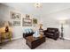 Cozy living room with a decorative coffee table and leather furniture at 3356 Longleaf Estates Dr, Raleigh, NC 27616