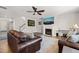 Comfortable living room with fireplace, ceiling fan, hardwood floors and neutral colors at 3356 Longleaf Estates Dr, Raleigh, NC 27616