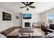 Open living room features a fireplace, ceiling fan, hardwood floors and neutral colors at 3356 Longleaf Estates Dr, Raleigh, NC 27616