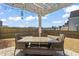 Covered outdoor patio with stylish pergola, dining and seating area at 3356 Longleaf Estates Dr, Raleigh, NC 27616
