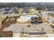 Aerial view of the neighborhood pool, clubhouse, and playground with ample parking space at 3356 Longleaf Estates Dr, Raleigh, NC 27616