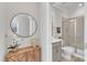 Bathroom featuring a glass-enclosed shower and grey vanity, viewed from doorway with decorative accents at 372 Natsam Woods Way, Wake Forest, NC 27587