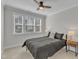 Cozy bedroom with a ceiling fan and large window providing natural light, creating a relaxing space at 372 Natsam Woods Way, Wake Forest, NC 27587