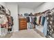Spacious walk-in closet with custom shelving and plenty of room for storage at 372 Natsam Woods Way, Wake Forest, NC 27587