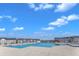 A sprawling neighborhood pool surrounded by well-maintained townhomes and blue skies at 372 Natsam Woods Way, Wake Forest, NC 27587