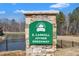 A natural stone sign at the entrance to E. Carroll Joyner Greenway at 372 Natsam Woods Way, Wake Forest, NC 27587
