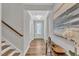 Inviting entryway with hardwood floors, elegant decor, and a clear view of the front door at 372 Natsam Woods Way, Wake Forest, NC 27587