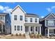 Charming two-story home with light gray siding and a welcoming front porch at 372 Natsam Woods Way, Wake Forest, NC 27587