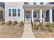 Close up of charming home with a covered front porch, perfect for relaxing and enjoying the outdoors at 372 Natsam Woods Way, Wake Forest, NC 27587
