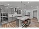Stylish kitchen with a large island, stainless steel appliances, and modern lighting at 372 Natsam Woods Way, Wake Forest, NC 27587