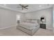 Spacious bedroom featuring a ceiling fan, carpeted floors and neutral paint providing a calming atmosphere at 372 Natsam Woods Way, Wake Forest, NC 27587