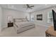 Spacious bedroom featuring a ceiling fan, carpeted floors and neutral paint providing a calming atmosphere at 372 Natsam Woods Way, Wake Forest, NC 27587