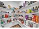 Walk-in pantry with custom shelving, providing ample storage space for food and kitchen essentials at 372 Natsam Woods Way, Wake Forest, NC 27587