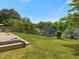Exterior showing a well-maintained lawn in the backyard with a partially fenced perimeter at 4 Hannah Ct, Durham, NC 27713