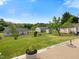 Large backyard features a well-maintained lawn, partial fencing and an outdoor living space at 4 Hannah Ct, Durham, NC 27713