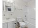 Bright bathroom features a tub-shower, vanity with mirror, and white fixtures at 4 Hannah Ct, Durham, NC 27713