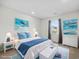 Nautical-themed bedroom with a white bed, blue accents, and a bright window at 4 Hannah Ct, Durham, NC 27713