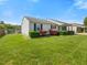 Exterior shot of a well-maintained home with manicured landscaping and a lush green lawn at 4 Hannah Ct, Durham, NC 27713