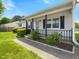 Inviting front porch with decorative railings and a well-maintained landscape at 4 Hannah Ct, Durham, NC 27713