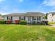 Charming single-story home with a well-manicured lawn and blooming shrubbery at 4 Hannah Ct, Durham, NC 27713