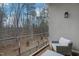 Balcony with a comfortable seating area overlooking a tranquil wooded landscape at 4007 Southpoint Landing Way, Durham, NC 27707