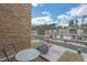 Balcony view overlooking modern townhomes, manicured lawns, and a street with parked cars at 4007 Southpoint Landing Way, Durham, NC 27707