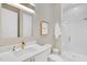 Well-lit bathroom featuring a walk-in shower, marble tile, and modern fixtures at 4007 Southpoint Landing Way, Durham, NC 27707