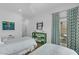 Bright bedroom with two beds, decorative shelving, and access to a patio with furniture at 4007 Southpoint Landing Way, Durham, NC 27707