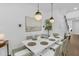 Elegant dining room with a white table, stylish chairs, and pendant lighting at 4007 Southpoint Landing Way, Durham, NC 27707