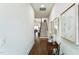 Inviting entryway with hardwood floors, staircase, and stylish decor setting a welcoming tone at 4007 Southpoint Landing Way, Durham, NC 27707