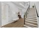 Elegant two-story foyer with hardwood floors and modern staircase showcasing the home's design at 4007 Southpoint Landing Way, Durham, NC 27707