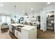 Spacious kitchen with large island, stainless appliances, and seamless flow to living and dining areas at 4007 Southpoint Landing Way, Durham, NC 27707
