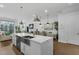 Spacious kitchen with large island, stainless appliances, and seamless flow to living and dining areas at 4007 Southpoint Landing Way, Durham, NC 27707