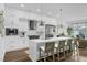 Bright, modern kitchen features stainless steel appliances, a large island and opens to living area at 4007 Southpoint Landing Way, Durham, NC 27707