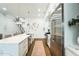 Open-concept kitchen with island, stainless steel appliances, and seamless transition to the living area at 4007 Southpoint Landing Way, Durham, NC 27707