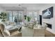 Well-appointed living room with plush seating, modern decor, fireplace and access to a private outdoor deck at 4007 Southpoint Landing Way, Durham, NC 27707