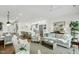 Open concept living area with modern white kitchen, dining area, and comfortable seating at 4007 Southpoint Landing Way, Durham, NC 27707