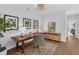 Bright office space with a wooden desk, stylish chair, and eclectic decor on hardwood floors at 4007 Southpoint Landing Way, Durham, NC 27707
