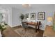 Bright office space with a wooden desk, stylish chair, and hardwood floors at 4007 Southpoint Landing Way, Durham, NC 27707