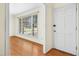 Bright entryway featuring hardwood floors and a large window that floods the space with natural light at 411 Colony Woods Dr, Chapel Hill, NC 27517