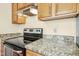 A kitchen features granite countertops, and stainless steel appliances at 411 Colony Woods Dr, Chapel Hill, NC 27517