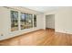 Bright and airy living room showcasing beautiful hardwood floors and large windows for ample natural light at 411 Colony Woods Dr, Chapel Hill, NC 27517