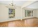 Spacious and inviting living room featuring hardwood floors and two large windows at 411 Colony Woods Dr, Chapel Hill, NC 27517