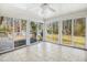 Spacious sunroom with lots of windows and tile flooring at 411 Colony Woods Dr, Chapel Hill, NC 27517
